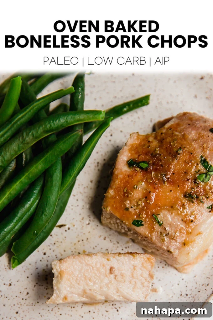 A beautifully composed Pinterest-optimized image featuring baked pork chops, with an emphasis on healthy eating and easy dinner ideas.