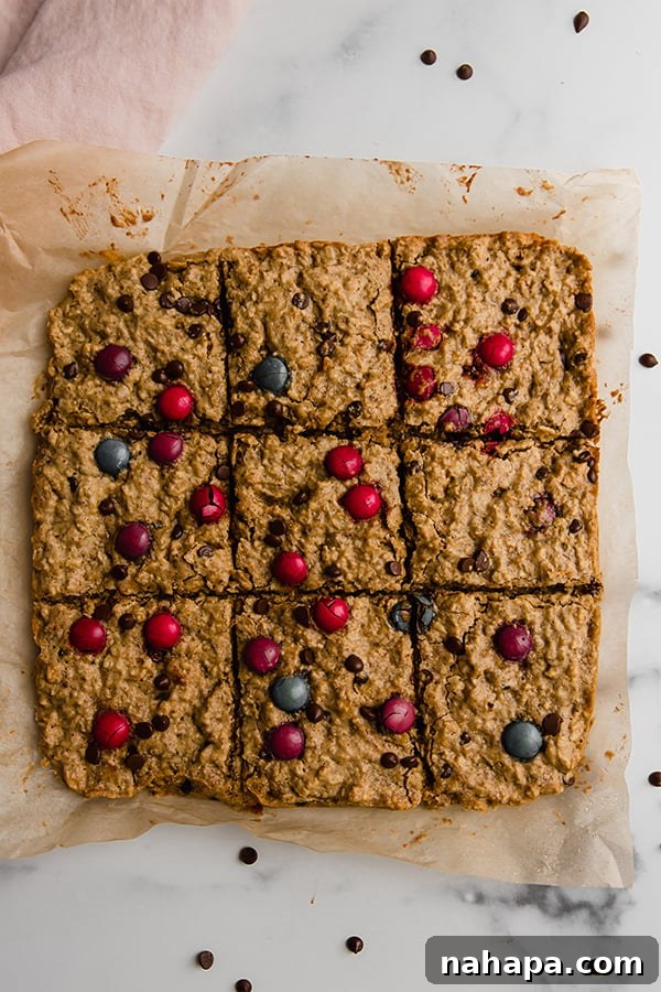 Top view of oatmeal breakfast bars cut into perfect squares on a kitchen counter