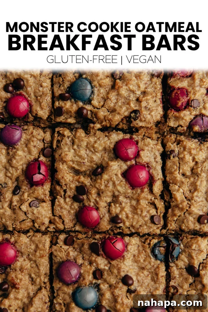 Full image of Monster Cookie Oatmeal Breakfast Bars with a vibrant Pinterest overlay