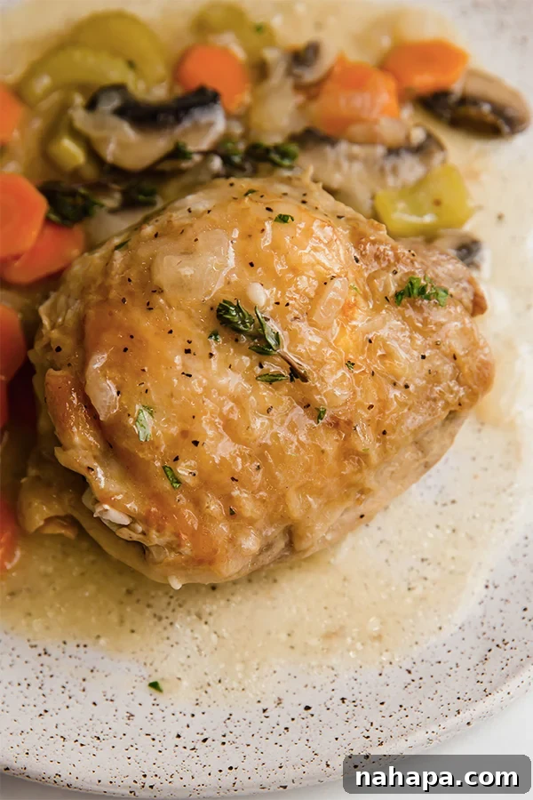 Another angle of the crispy Chicken Fricassee in the pan, showing off the rich sauce and tender vegetables.