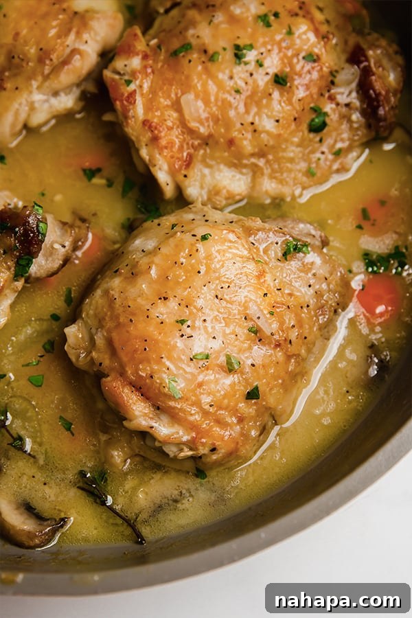A plate of Chicken Fricassee with crispy chicken and creamy sauce