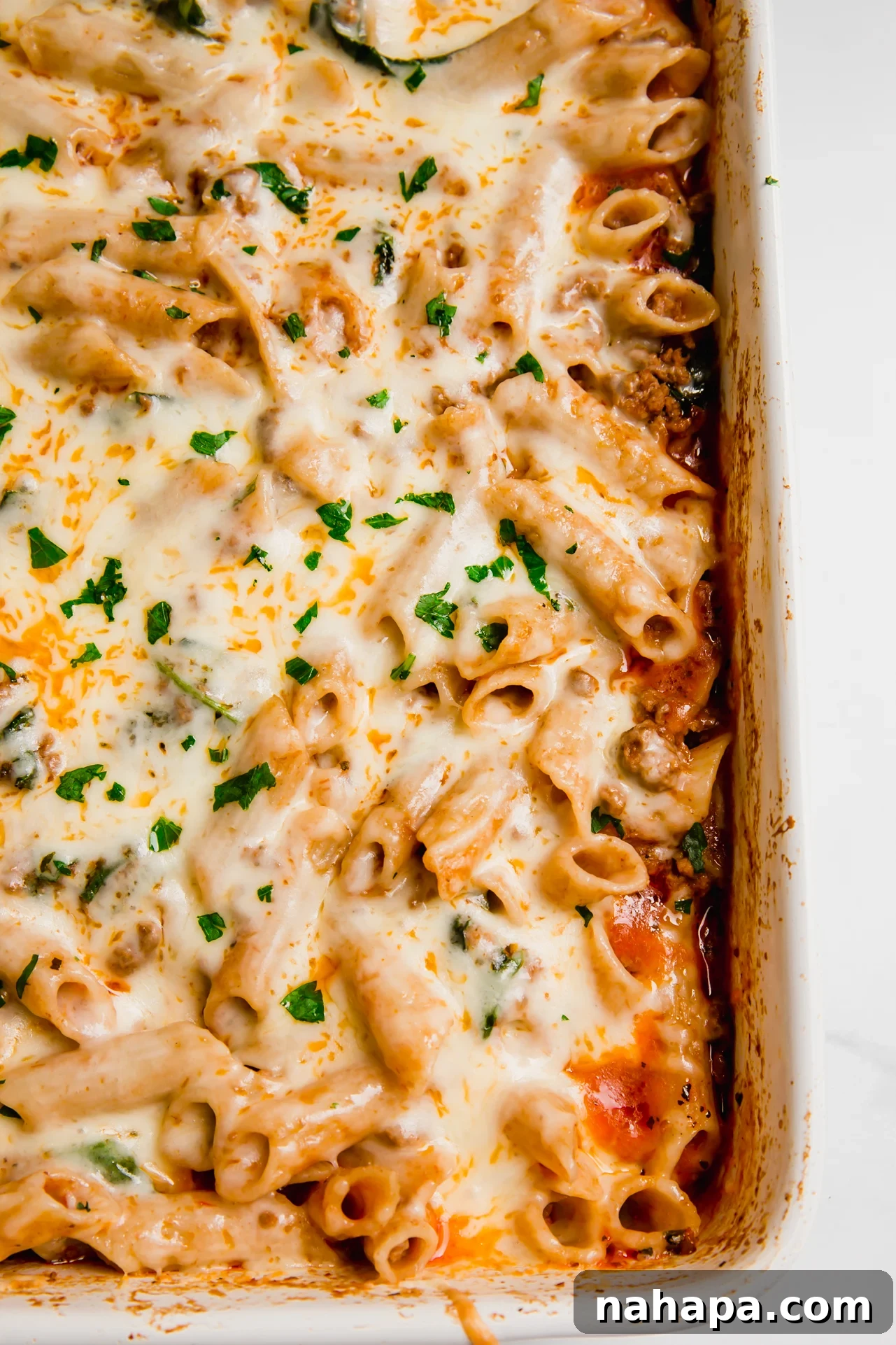 No boil pasta bake in a ceramic baking dish, ready to be served. 