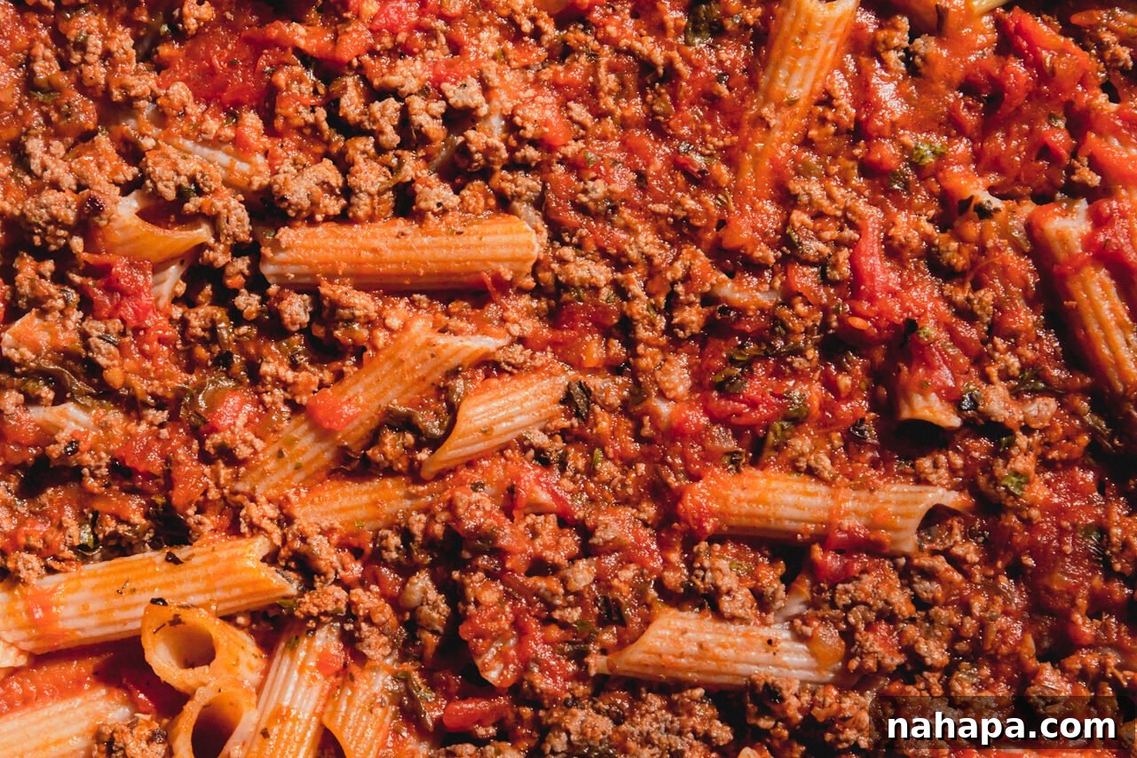 The cooked no-boil pasta bake with the cover removed, showing tender pasta and rich sauce.