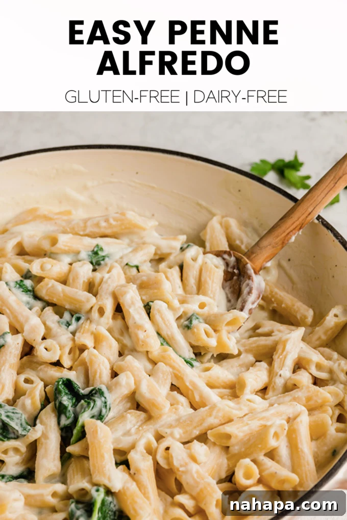 Penne Alfredo served in a bowl with fresh parsley