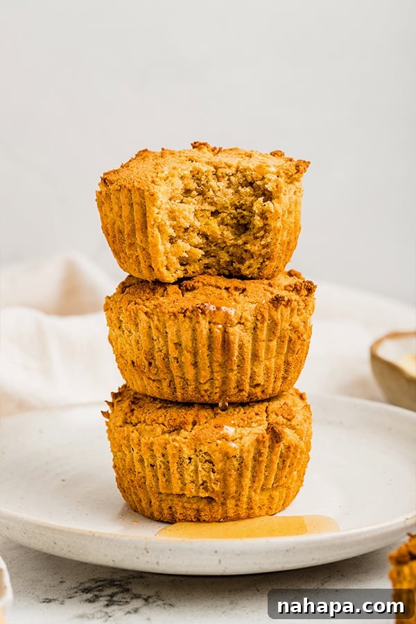 A stack of golden grain-free cornbread muffins, tempting and delicious.