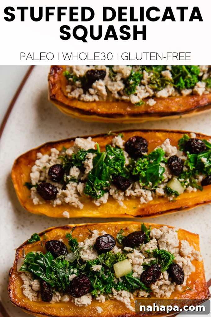 A beautifully composed flat lay of a stuffed delicata squash, cranberries, and herbs, ready for serving.