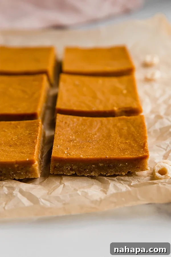 Close-up of baked pumpkin pie bars, freshly made and ready to be chilled.