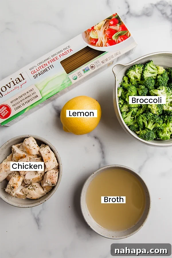 Easy One-Pot Lemon Chicken Pasta Gluten Free Dairy Free 3 A selection of fresh ingredients for lemon chicken pasta: spaghetti, broccoli, lemon, chicken, and herbs.