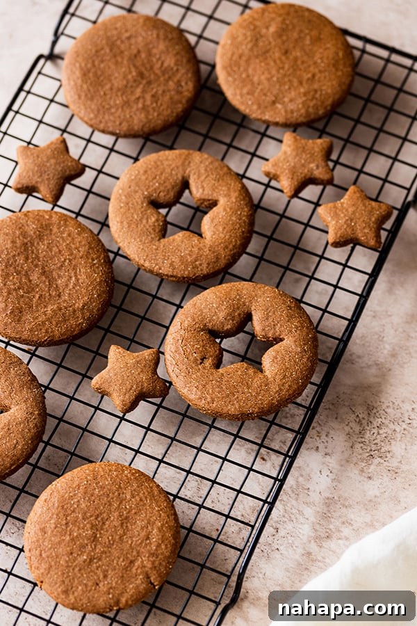 Chocolate Gingerbread Sandwich Cookies Paleo AIP 6 A batch of freshly baked gingerbread cookies, golden brown and perfectly formed, cooling on a wire rack.