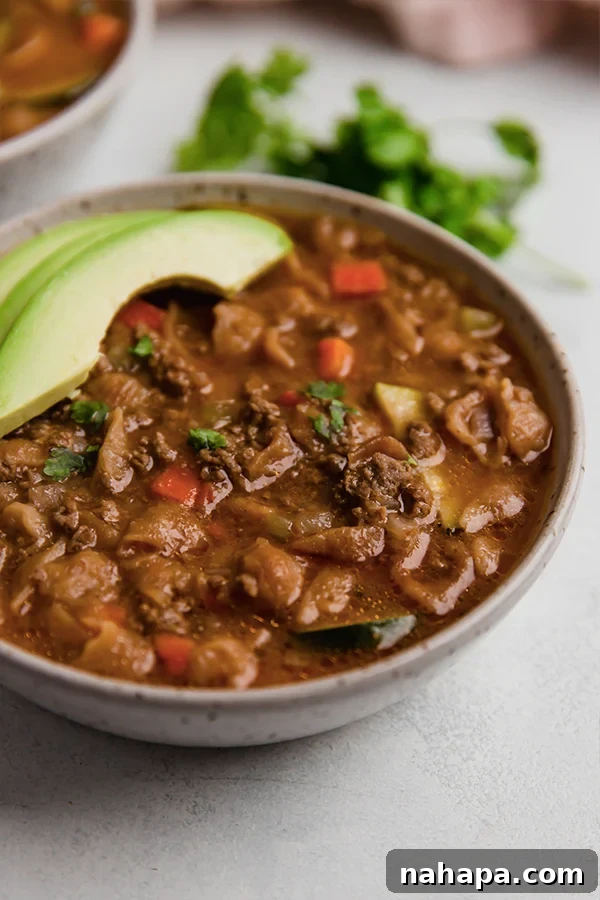 A close-up of a bowl of conchitas con Carne ready to be served.