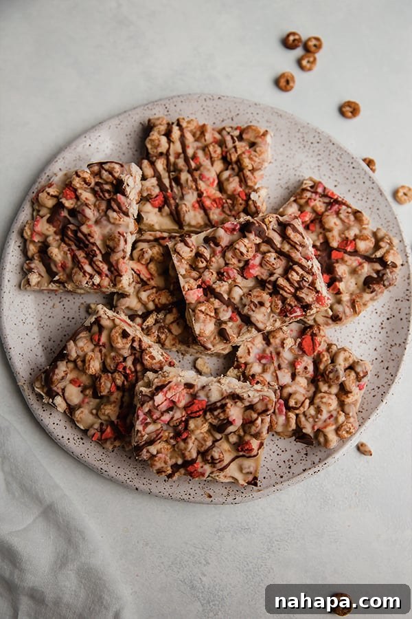 Several homemade Strawberry Cacao Cereal bars artfully arranged on a serving plate, ready to be enjoyed as a healthy, allergen-friendly snack.
