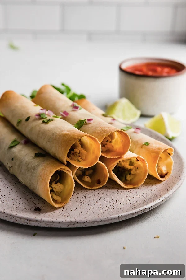 Wholesome Paleo Gluten-Free Ground Turkey Avocado Taquitos 7 A perfectly plated serving of ground turkey and avocado taquitos, ready to be enjoyed with a fresh dip.
