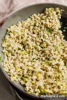 Wholesome Paleo Gluten-Free Ground Turkey Avocado Taquitos 9 Cooking ground turkey and zucchini in a skillet.