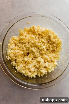 Shredded sweet potato in a bowl, showing texture.