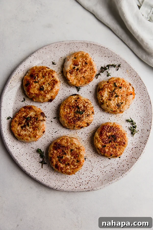 A plate generously filled with golden-brown turkey breakfast sausages, ready to be enjoyed as a delicious and satisfying meal.