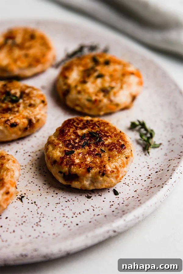 A plate with golden-brown turkey breakfast sausages on it, showcasing their delicious texture and inviting appearance.