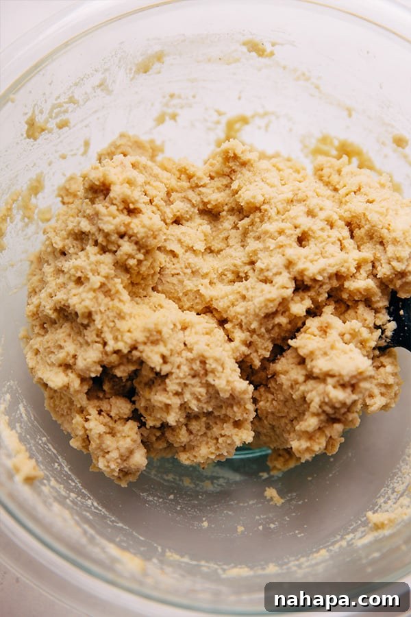 Wholesome Gluten Free Paleo Egg Free Applesauce Pound Cake 3 The moist and firm batter for the paleo pound cake in a mixing bowl.