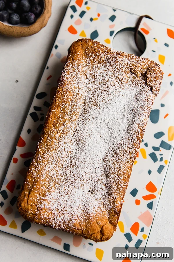 Wholesome Gluten Free Paleo Egg Free Applesauce Pound Cake 4 A beautifully baked loaf of paleo pound cake, golden brown and ready to slice.