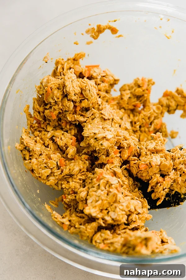 Sticky and firm applesauce carrot cookie dough in a mixing bowl