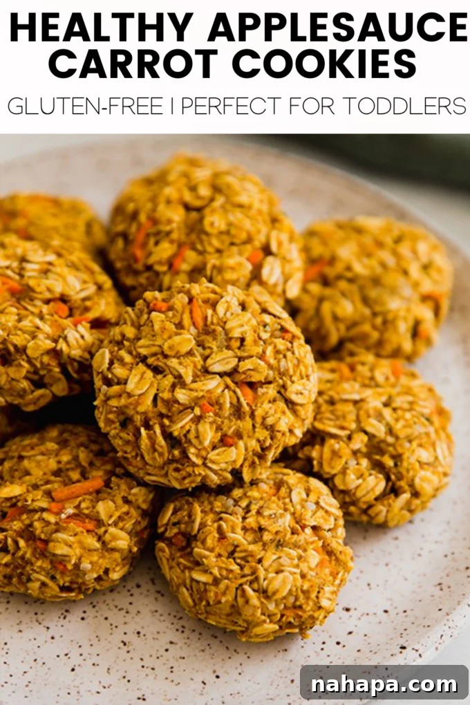 Overhead shot of applesauce carrot cookies on a baking sheet