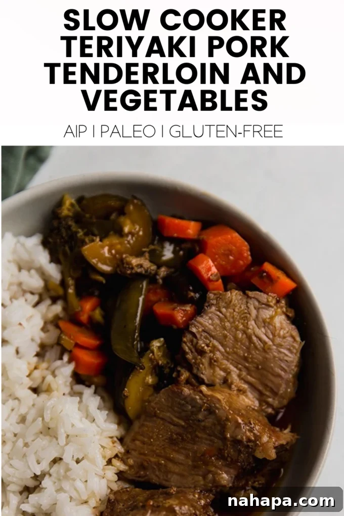 A vibrant platter of Slow Cooker Teriyaki Pork Tenderloin with fresh vegetables, garnished and ready to serve, highlighting its appeal as a healthy and delicious meal.