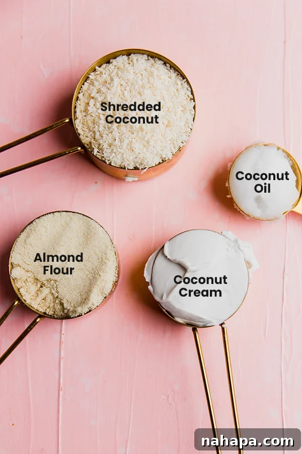 The ingredients for coconut macaroons laid out on a surface.