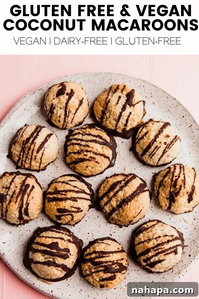 A large image of delicious coconut macaroons, some dipped in chocolate.