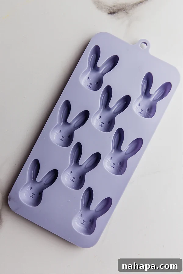 Silicone bunny molds ready to be filled with melted chocolate for homemade Easter treats.
