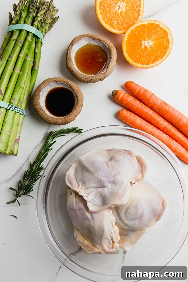 The ingredients for citrus glazed chicken laid out on a table.