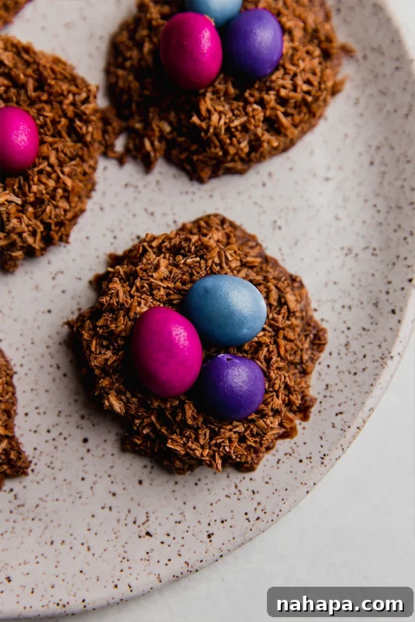 Sweet Coconut Chocolate Easter Nests 2 Delicious Chocolate Coconut Easter Egg Nests arranged on a decorative plate, ready to be enjoyed.