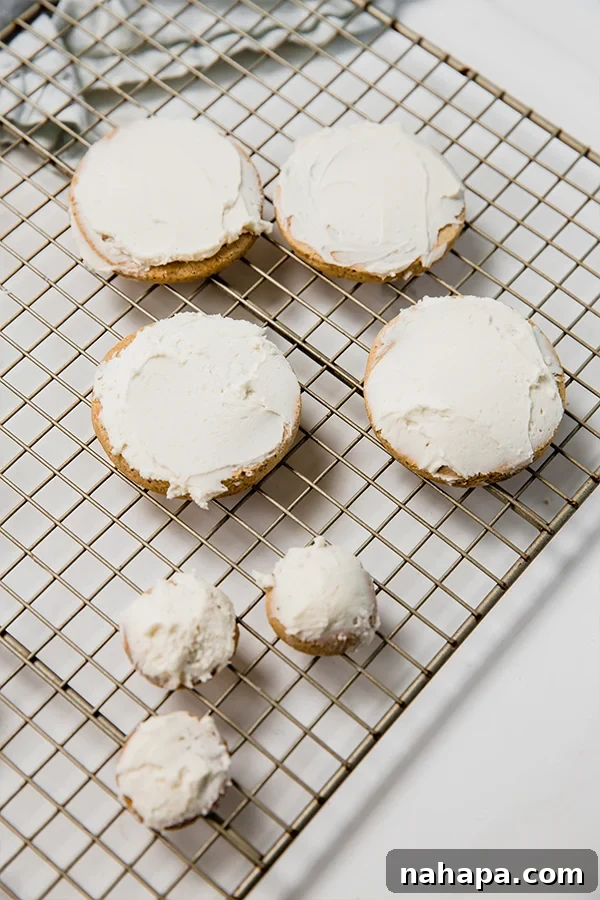 frosted cookies on a cooling rack