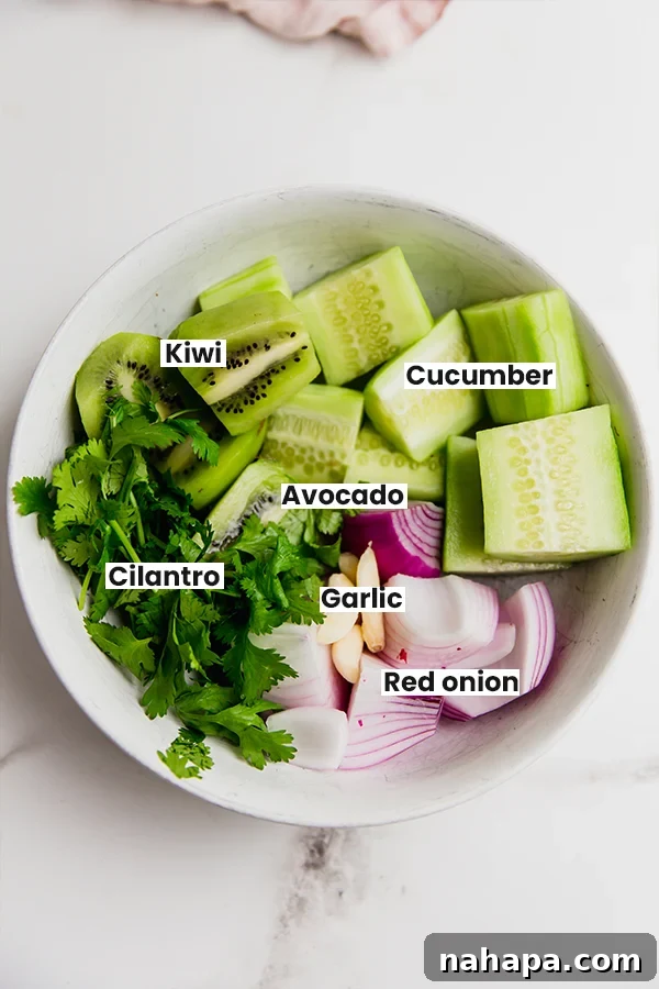 All the vibrant ingredients for AIP nightshade-free salsa verde laid out on a clean surface, ready for blending.