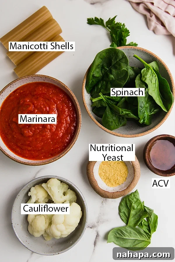 Savory Vegan Cauliflower Ricotta Manicotti Gluten Free 3 An array of fresh ingredients laid out on a table, ready for making gluten-free cauliflower manicotti.