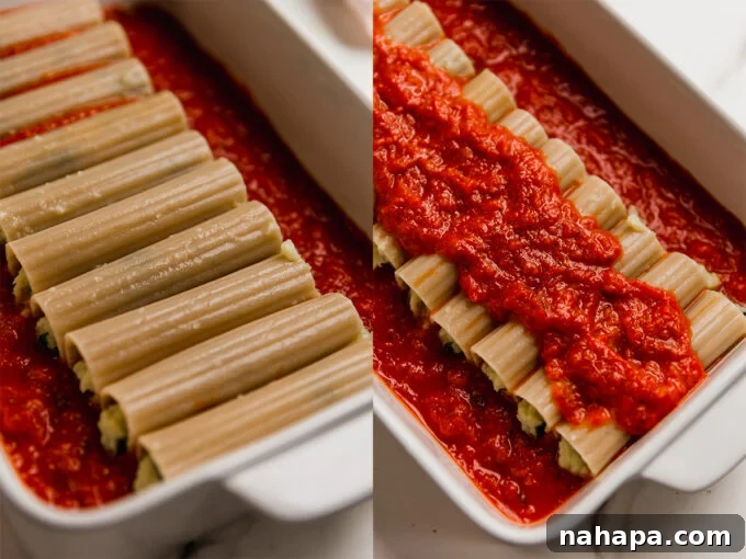 Savory Vegan Cauliflower Ricotta Manicotti Gluten Free 5 A baking dish filled with meticulously arranged gluten-free manicotti, coated in marinara sauce and ready for the oven.