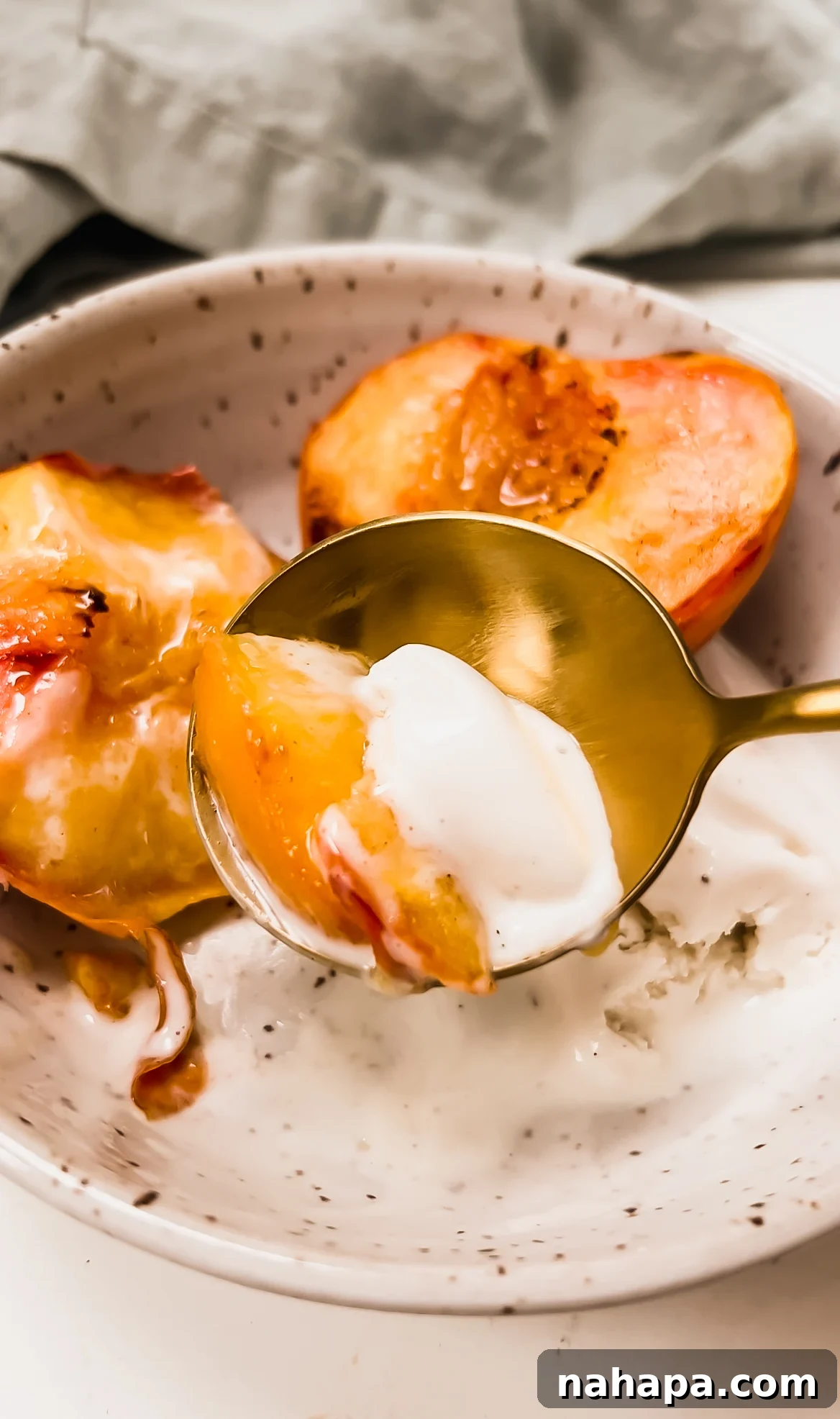 Air Fryer Peaches served with dairy-free ice cream.