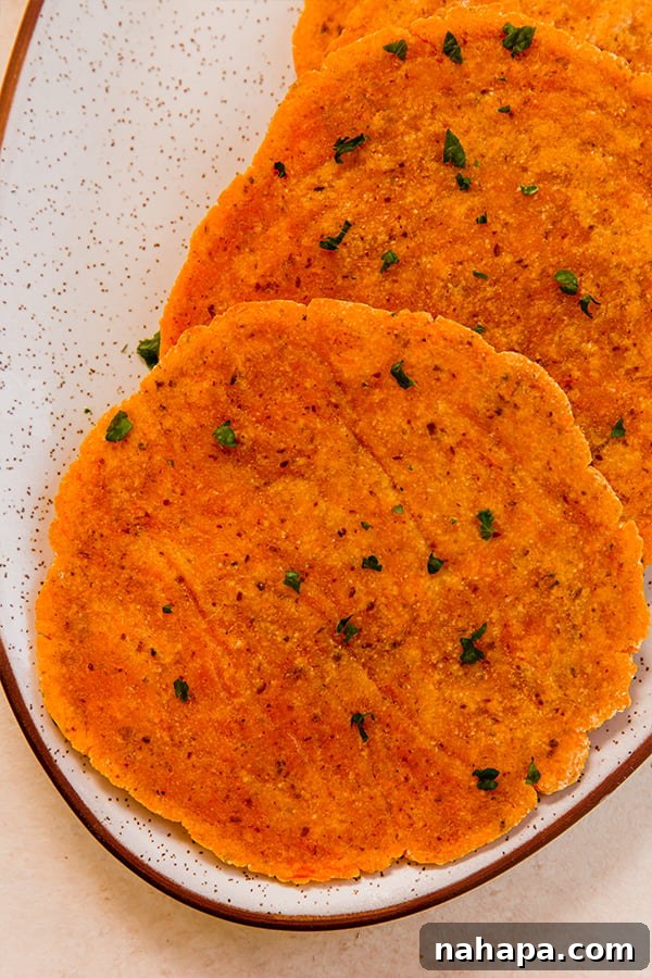 Golden Sweet Potato Flatbread 5 A simple plate with a stack of sweet potato flatbreads, ready for serving.