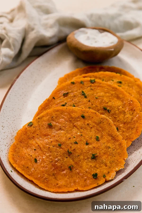 Golden Sweet Potato Flatbread 6 A plate of golden-brown sweet potato flatbreads.