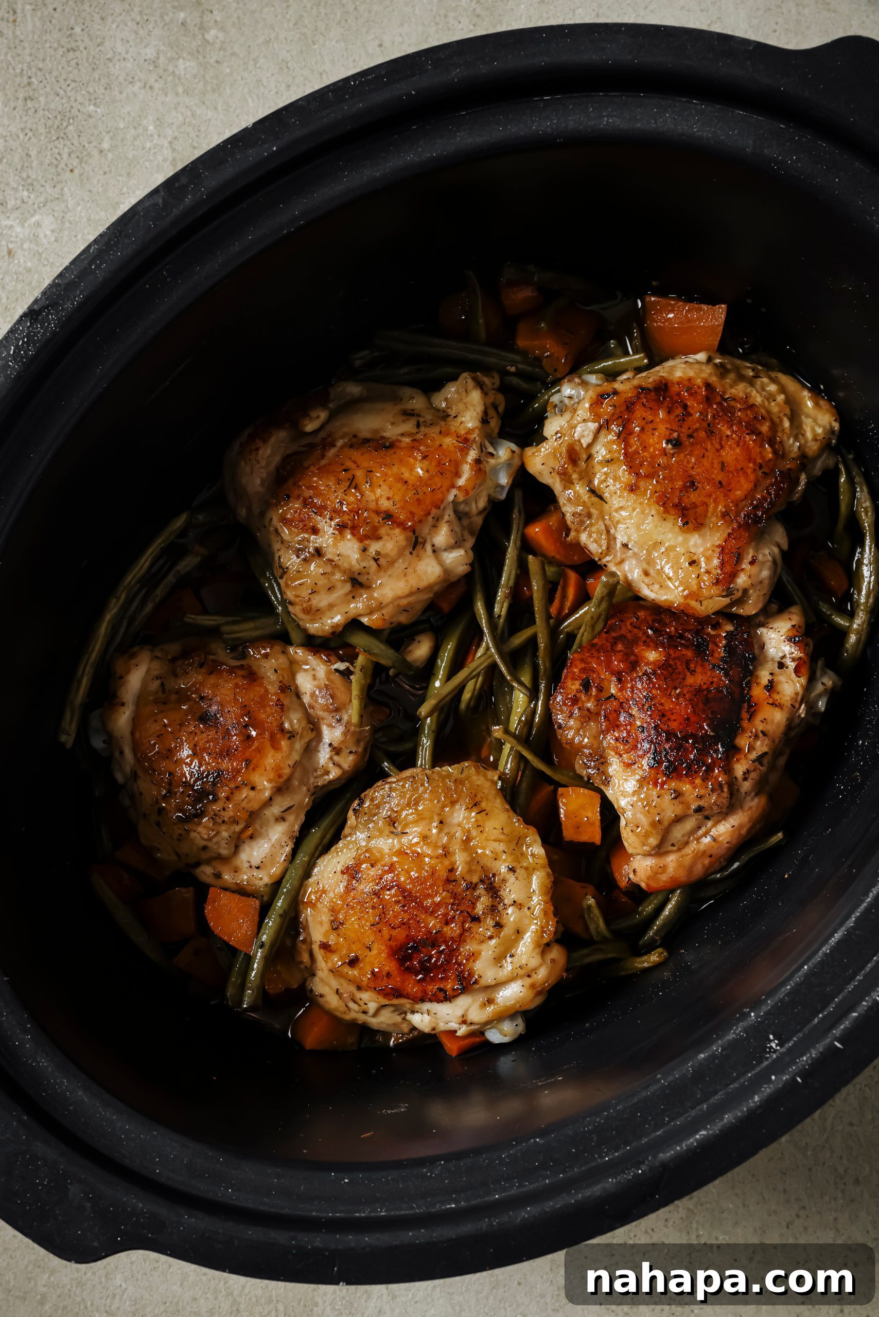 Hearty Slow Cooker Balsamic Chicken and Mixed Vegetables 7 Slow cooker with lid on, cooking balsamic chicken and vegetables.