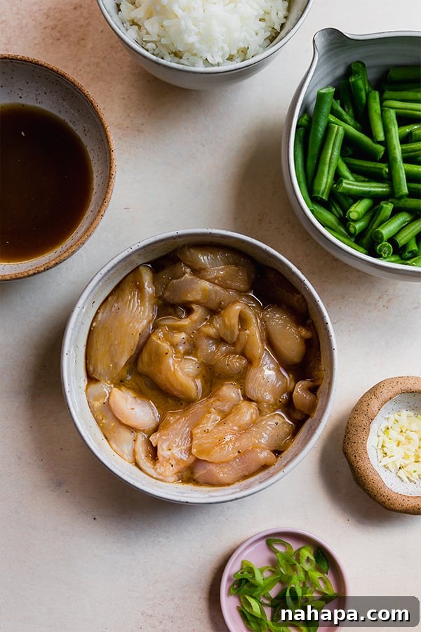 Chicken marinating with other fresh string bean chicken ingredients ready for cooking