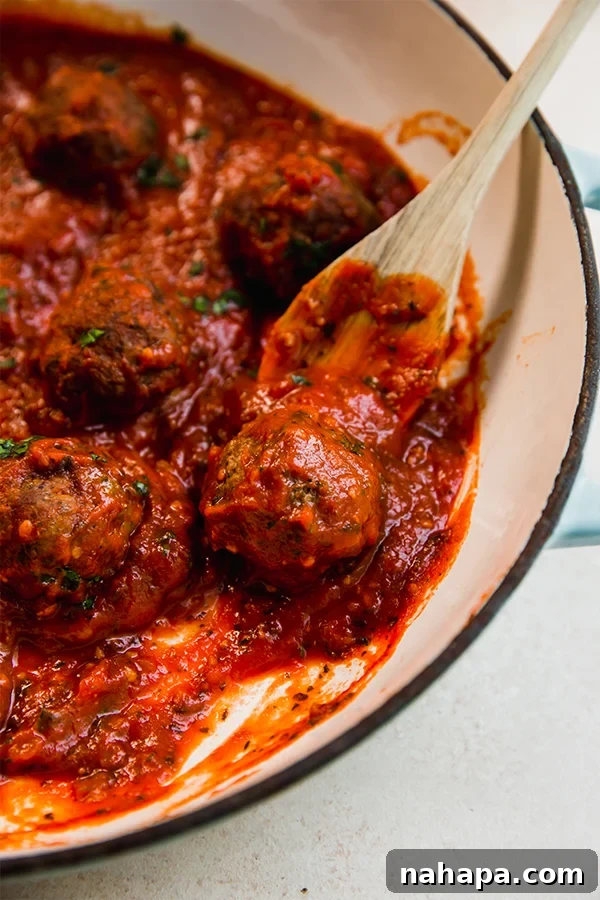 Rustic Italian Lamb Meatballs 2 A pot cooking Italian lamb meatballs.