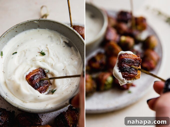 A close-up of a bacon wrapped Brussels sprout being dipped into a creamy garlic lemon aioli.