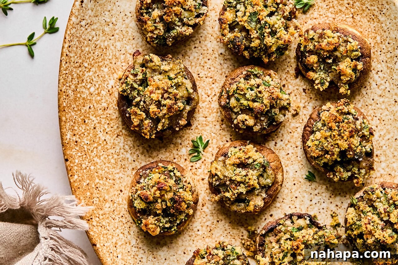 A serving platter adorned with the perfectly cooked gluten and dairy-free stuffed mushrooms, ready to be enjoyed as a gourmet appetizer.
