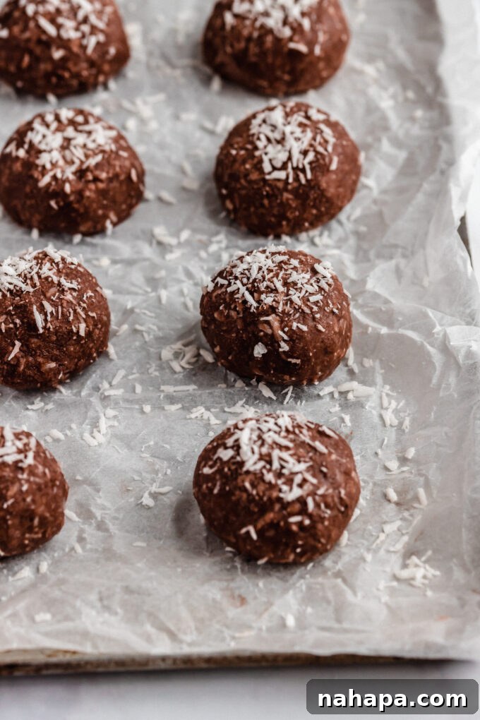 Several chocolate collagen protein bites arranged on a serving board.