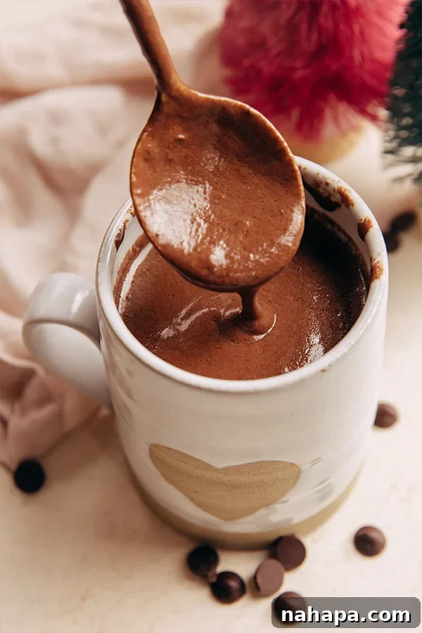 A mug of Italian Hot Chocolate (Dairy-Free) garnished with chocolate drizzle.