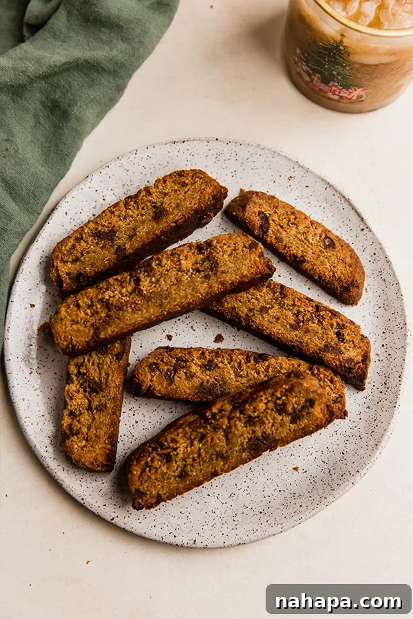 Indulgent Gluten-Free Chocolate Chip Biscotti 5 A generous plate filled with freshly baked gluten-free chocolate chip biscottis, inviting you to indulge.