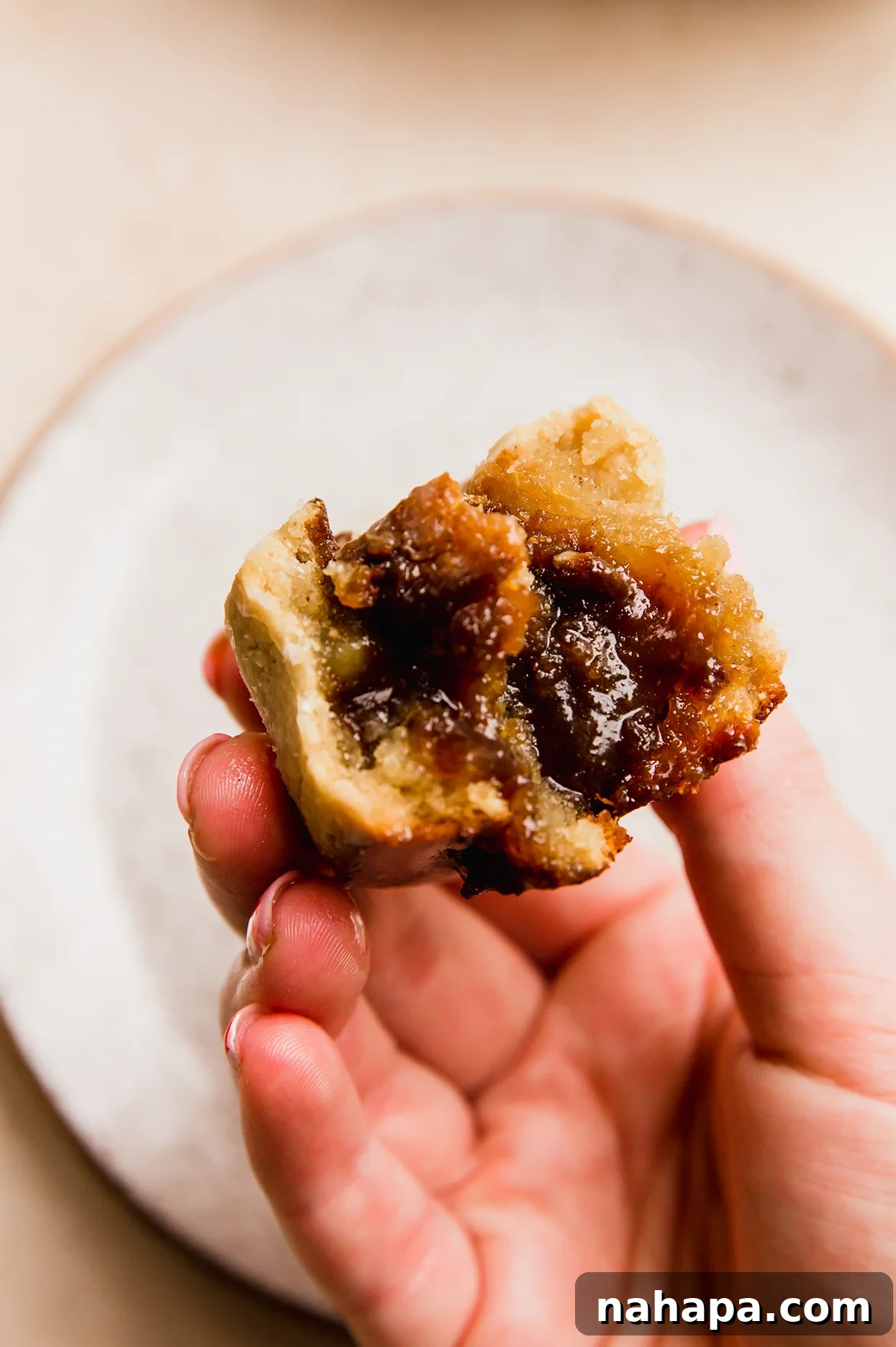 Delicious Gluten Free and AIP Gingerbread Cinnamon Rolls 9 Gooey gluten free gingerbread cinnamon rolls bitten in half.