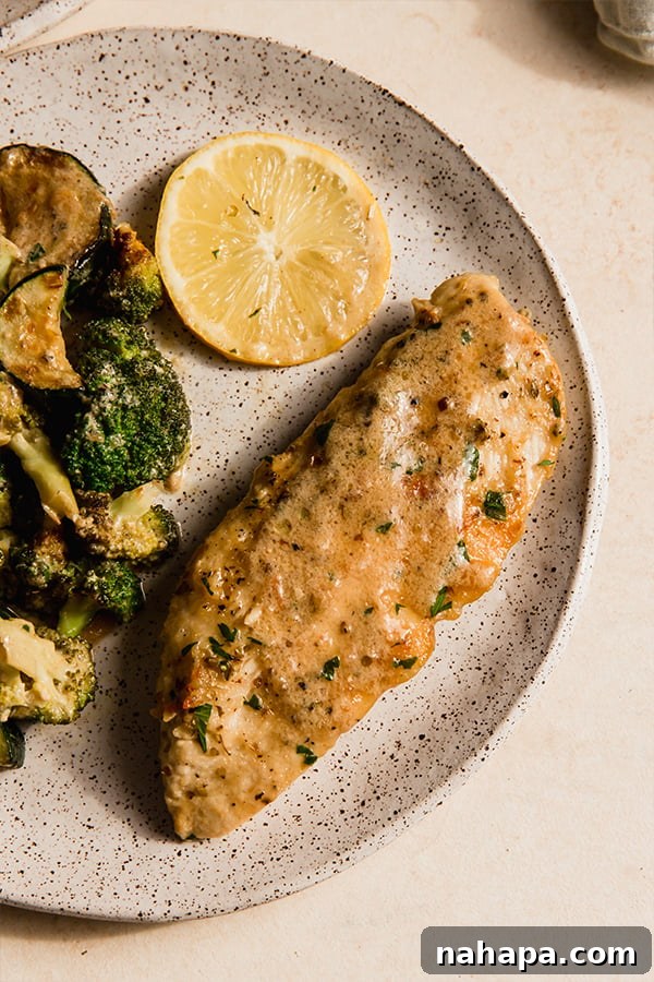 A plate with one pan creamy garlic chicken and vegetables.