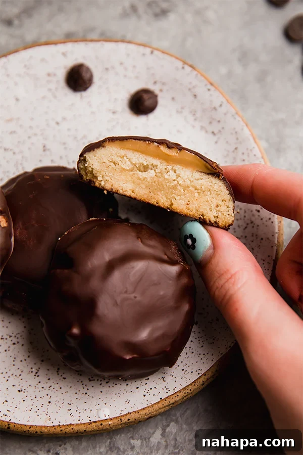 Homemade Gluten-Free Tagalong Delights 2 A plate filled with delicious gluten-free copycat Tagalong cookies, showcasing their crisp texture, almond butter filling, and rich chocolate coating.