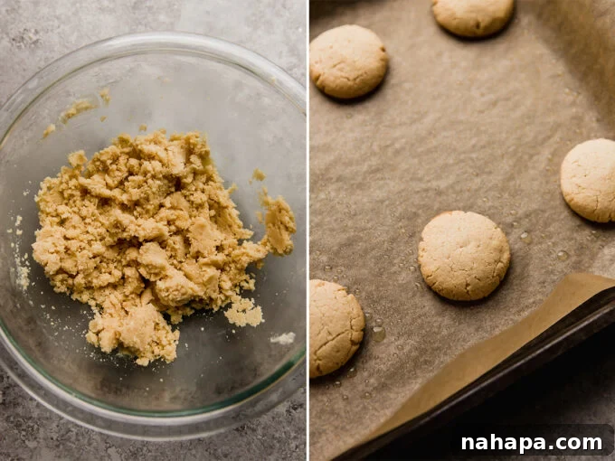 Homemade Gluten-Free Tagalong Delights 4 The unbaked dough for copycat Tagalong cookies, perfectly shaped into small, round discs on a baking sheet, ready for the oven.