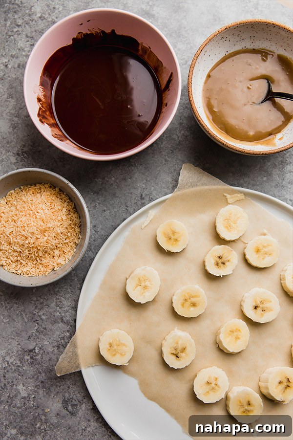 All the fresh ingredients laid out for making Samoa Banana Bites, including bananas, chocolate chips, coconut cream, and shredded coconut.